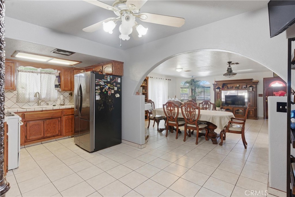 381 B Street Arvin, CA 93203 - Photo 7 of 23 a living room with furniture a dining table and chairs