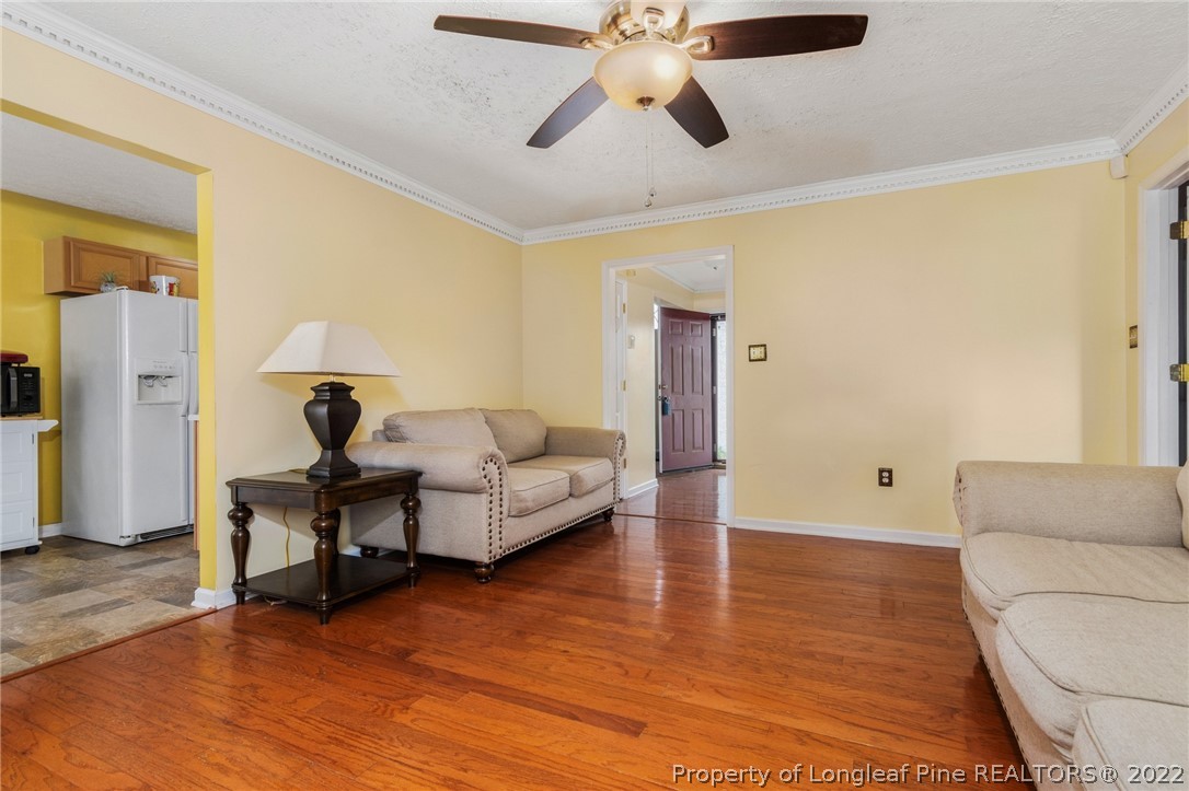 1070 Roundabout Road Cameron, NC 28326 - Photo 11 of 34 a living room with furniture and a wooden floor