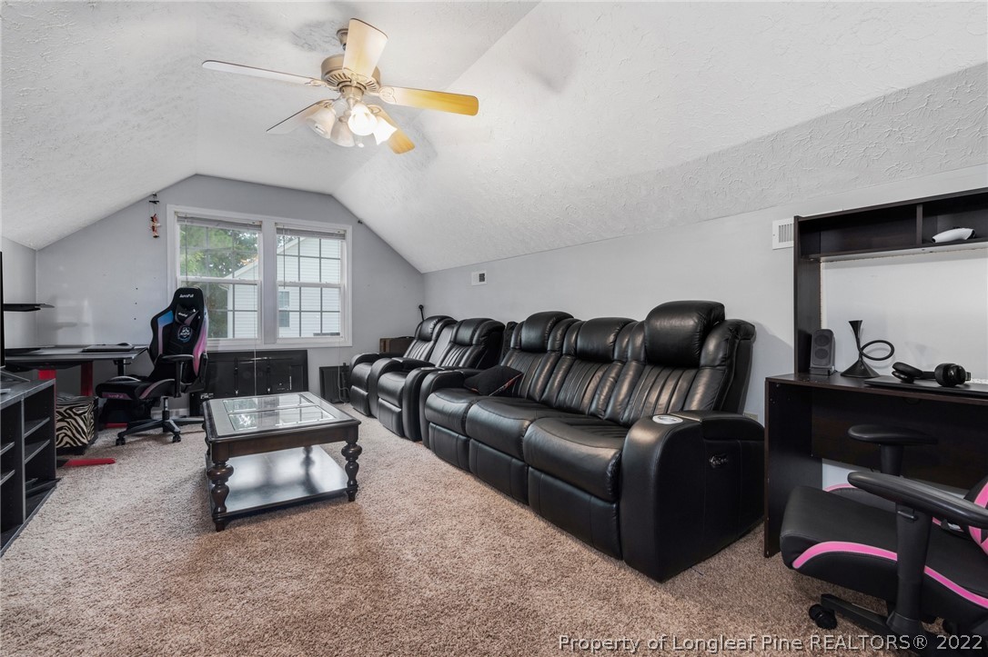 1070 Roundabout Road Cameron, NC 28326 - Photo 13 of 34 a living room with furniture and a lamp