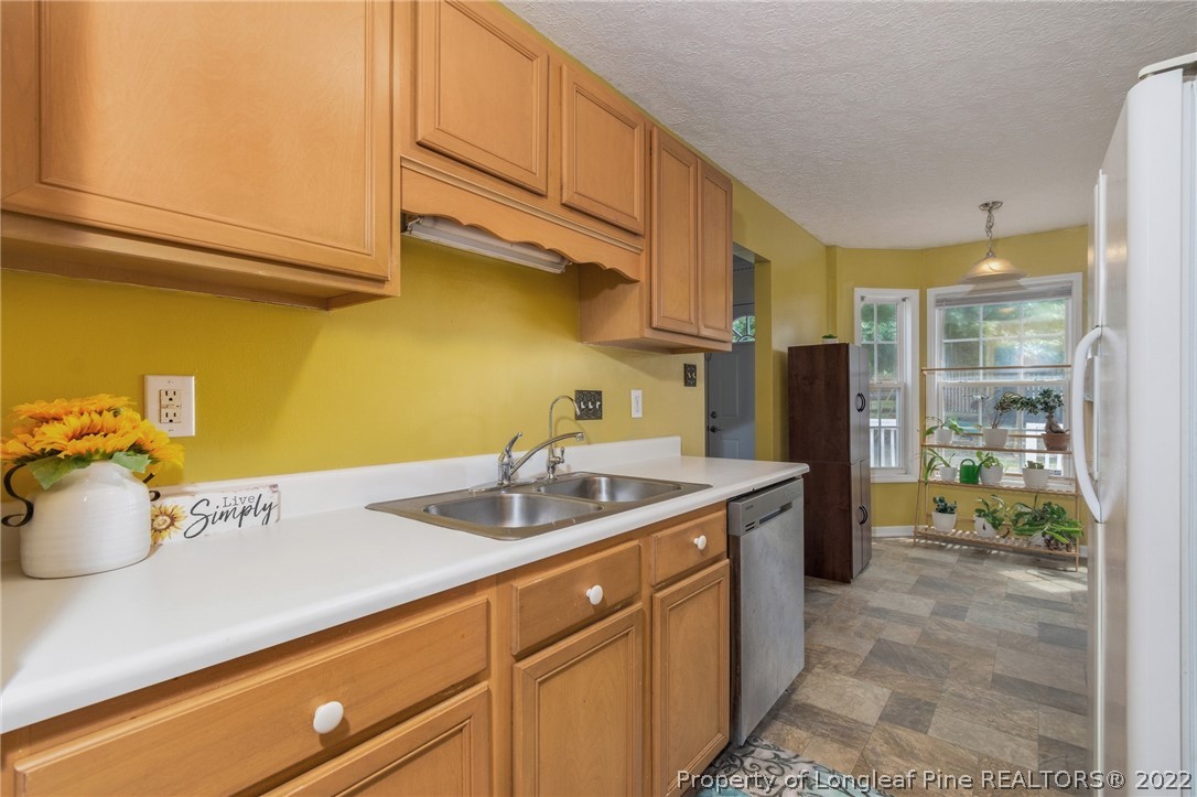 1070 Roundabout Road Cameron, NC 28326 - Photo 17 of 34 a kitchen with a sink and cabinets