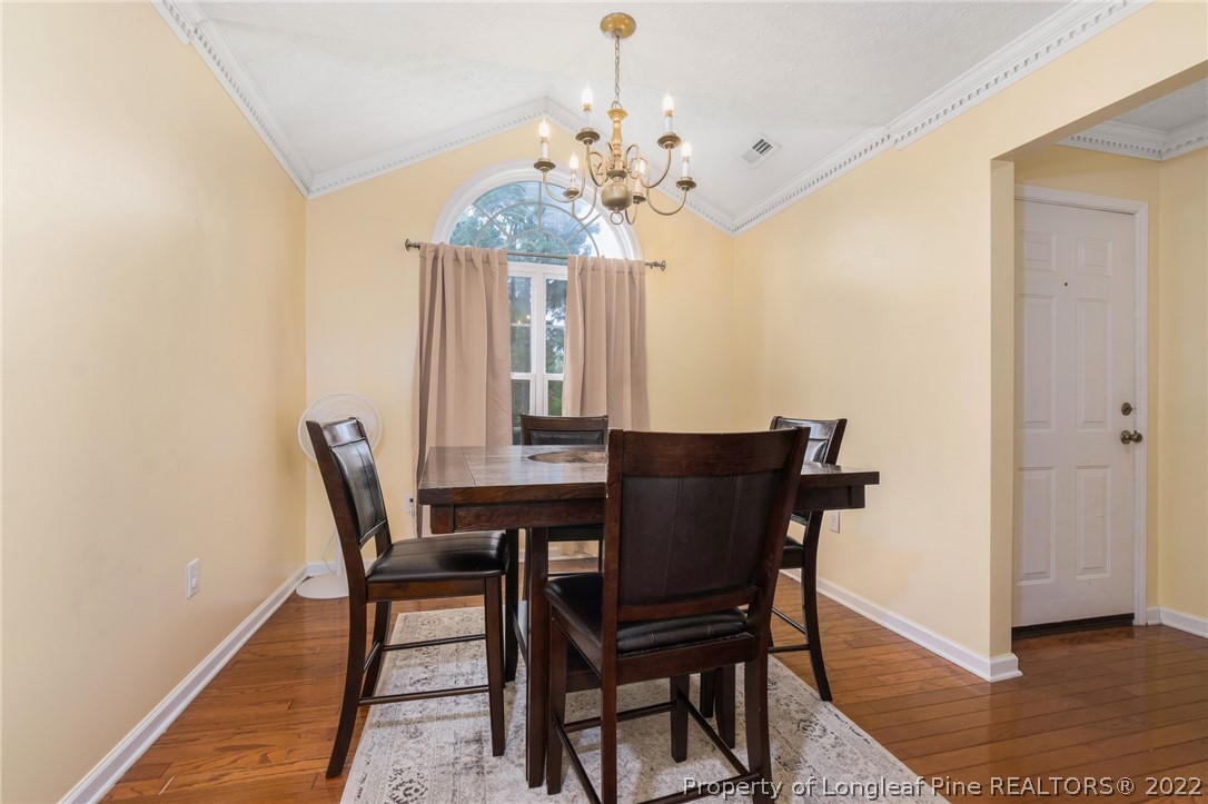 1070 Roundabout Road Cameron, NC 28326 - Photo 19 of 34 a view of a dining room with furniture and chandelier