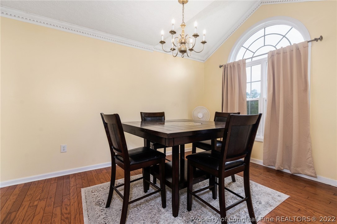 1070 Roundabout Road Cameron, NC 28326 - Photo 20 of 34 a view of a dining room with furniture and chandelier