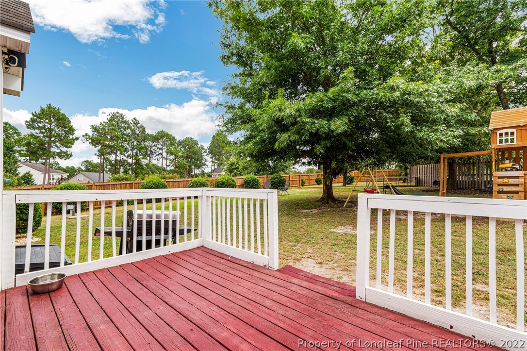 1070 Roundabout Road Cameron, NC 28326 - Photo 30 of 34 a view of balcony with wooden floor and fence