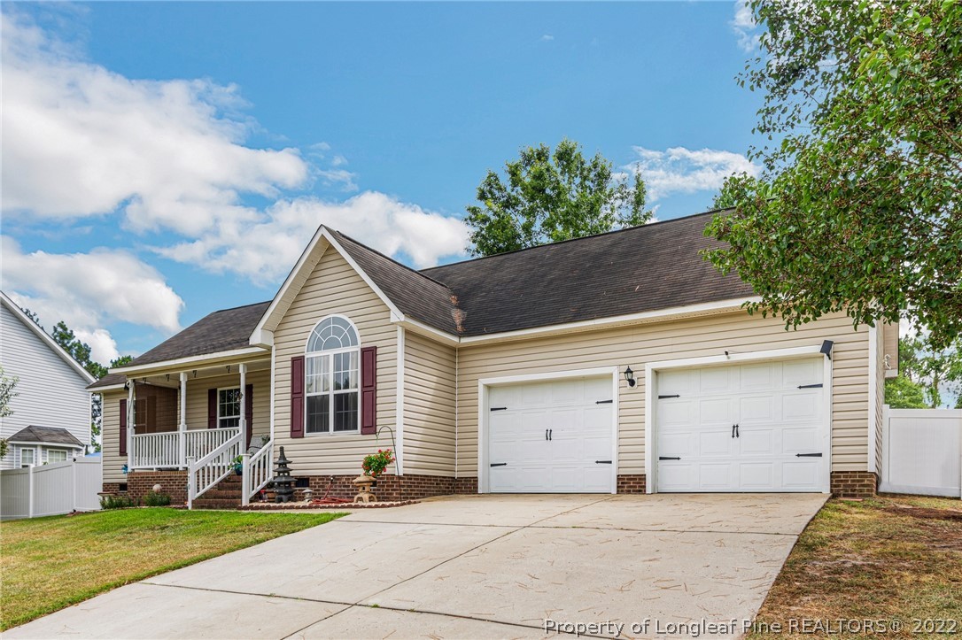 1070 Roundabout Road Cameron, NC 28326 - Photo 3 of 34 a front view of a house with a yard