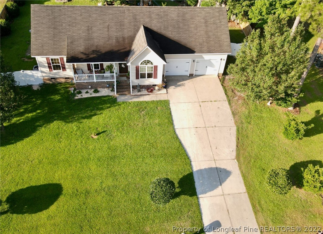 1070 Roundabout Road Cameron, NC 28326 - Photo 4 of 34 a aerial view of a house with a yard and potted plants
