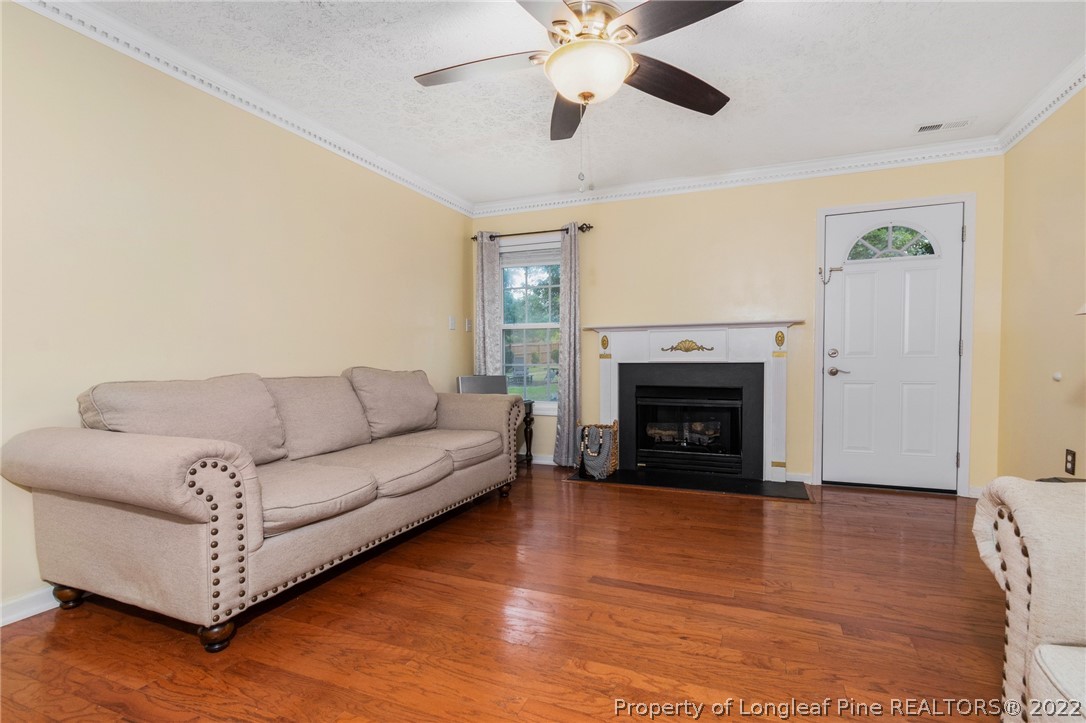 1070 Roundabout Road Cameron, NC 28326 - Photo 9 of 34 a living room with furniture and a fireplace