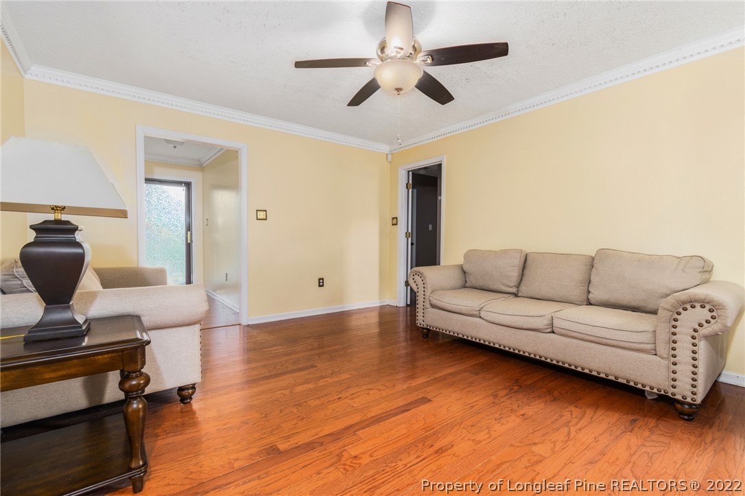 1070 Roundabout Road Cameron, NC 28326 - Photo 10 of 34 a living room with furniture and a wooden floor