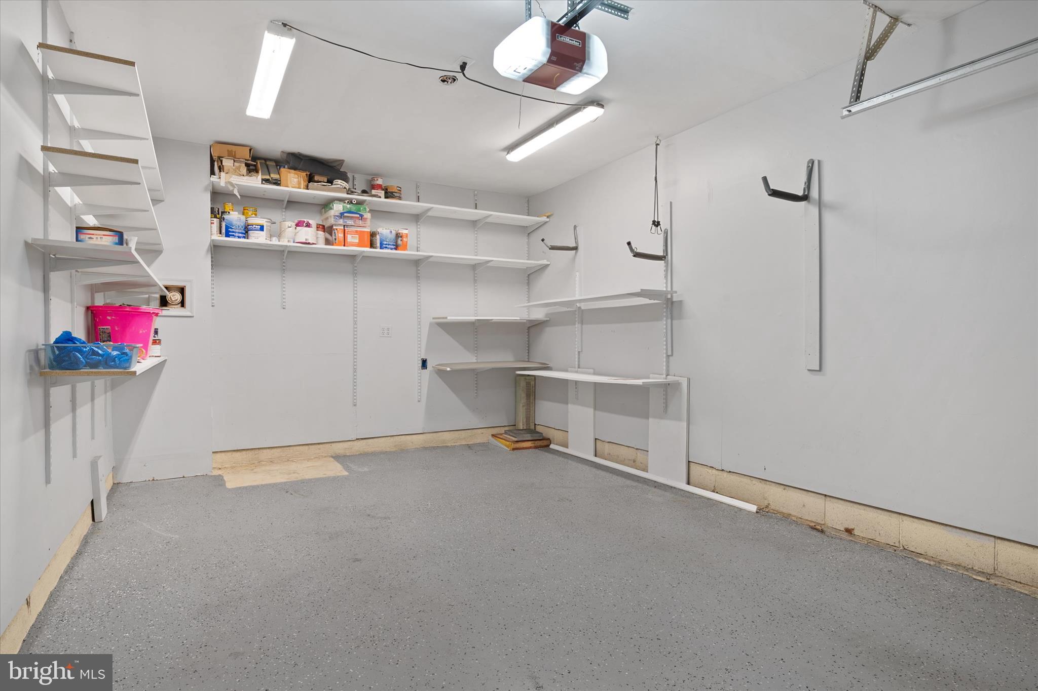19 Spindrift Way Annapolis, MD 21403 - Photo 30 of 34 New epoxy flooring in garage and plenty of storage