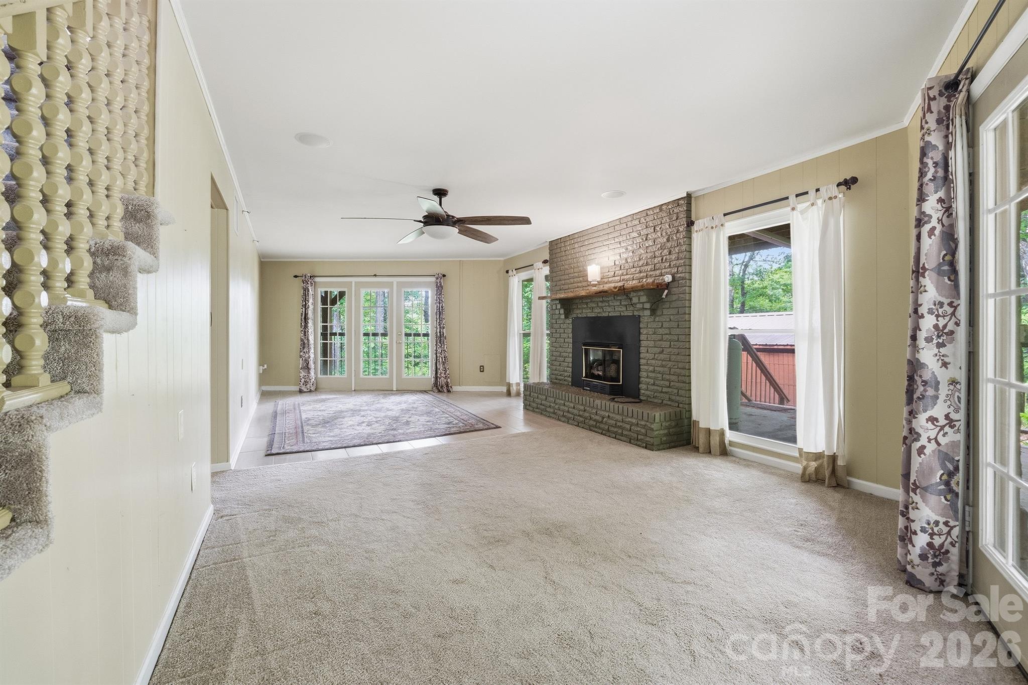 3190 Holly Road Connelly Springs, NC 28612 - Photo 11 of 42 a view of a livingroom with a fireplace and window