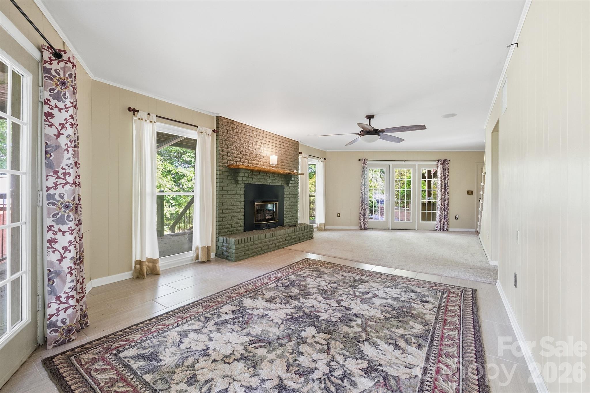 3190 Holly Road Connelly Springs, NC 28612 - Photo 14 of 42 a view of an empty room with window and fire place