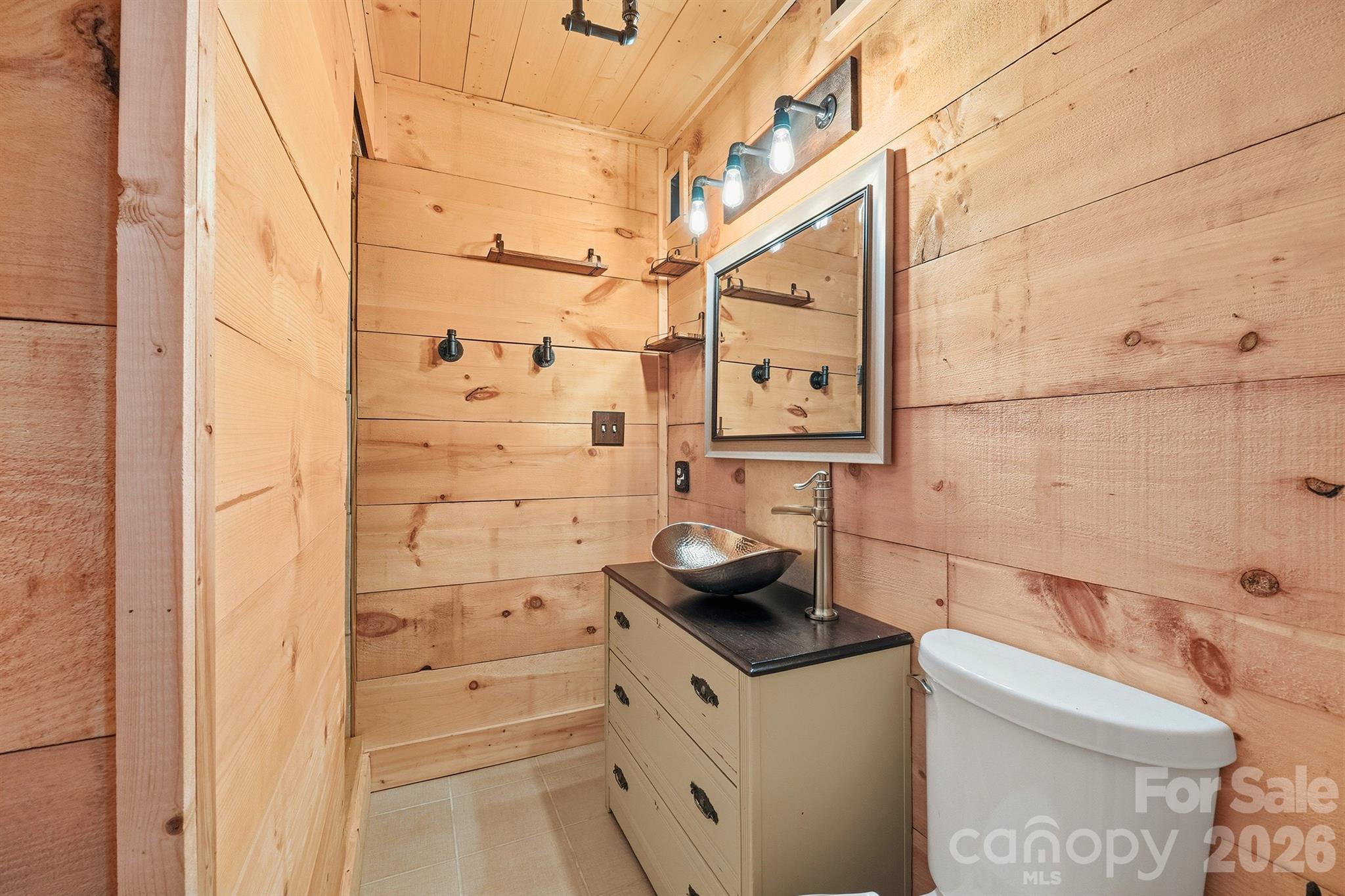 3190 Holly Road Connelly Springs, NC 28612 - Photo 15 of 42 a bathroom with a shower and a sink