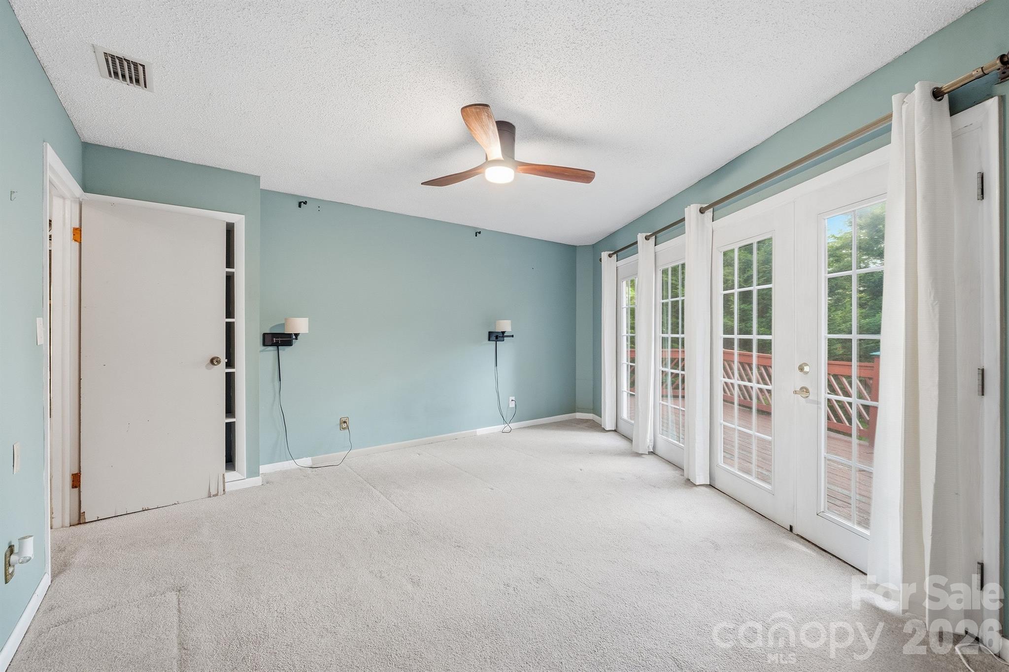 3190 Holly Road Connelly Springs, NC 28612 - Photo 25 of 42 a view of a livingroom with a chandelier fan and windows