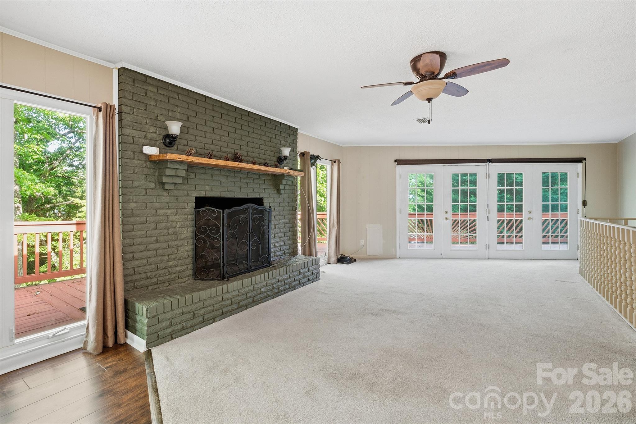 3190 Holly Road Connelly Springs, NC 28612 - Photo 40 of 42 a view of an empty room with a fireplace and a window