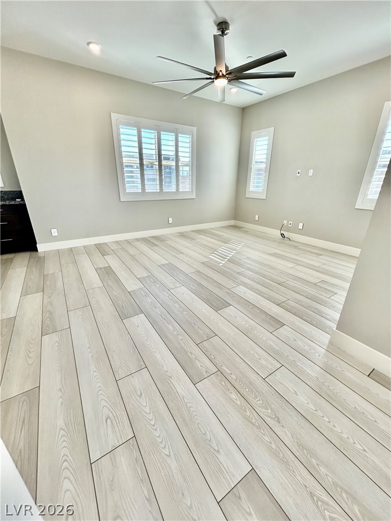 4262 Swift Street Las Vegas, NV 89135 - Photo 69 of 75 Spare room featuring light wood-type flooring and a ceiling fan