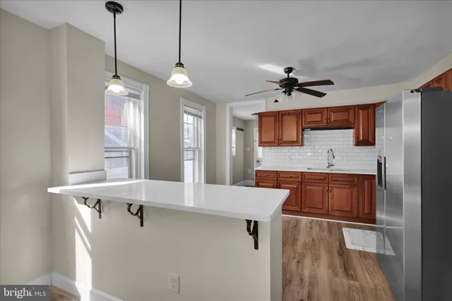 a very nice looking kitchen with a large window appliances