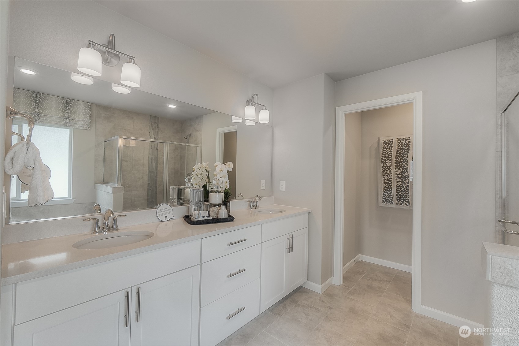 23413 41st Drive Southeast, Unit 28 Bothell, WA 98021 - Photo 18 of 20 a bathroom with a double vanity sink and a mirror