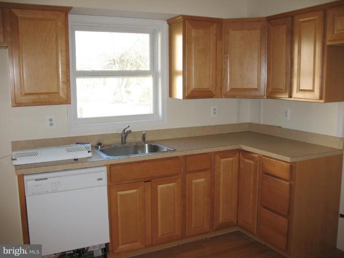 1848 Montreal Road Severn, MD 21144 - Photo 2 of 5 a kitchen with a sink cabinets and window