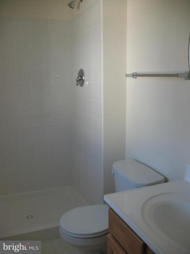 1848 Montreal Road Severn, MD 21144 - Photo 5 of 5 a white toilet sitting next to a shower