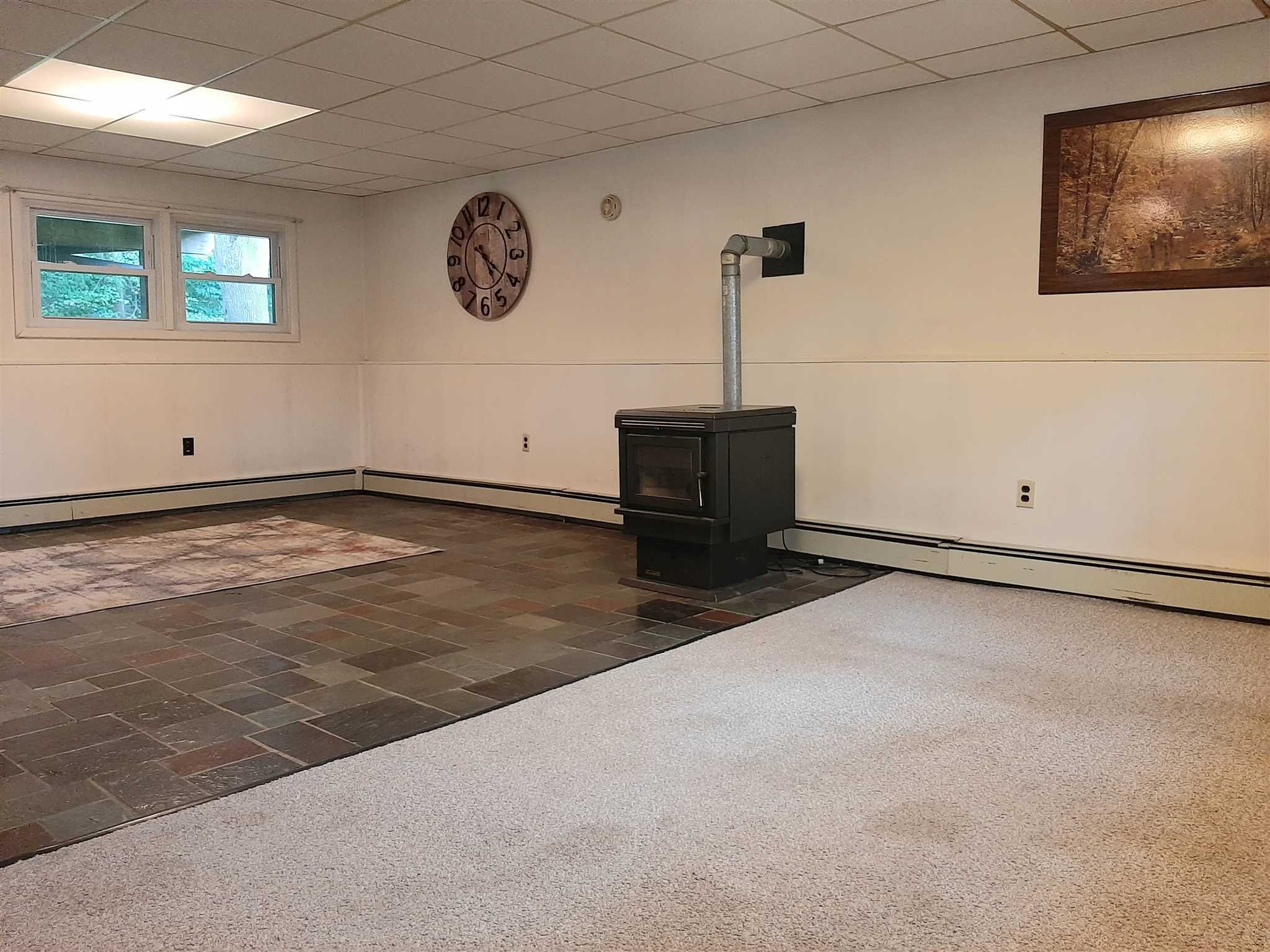 97 Sutton Park Road Poughkeepsie, NY 12603 - Photo 15 of 20 a view of a room with gym equipment and a window
