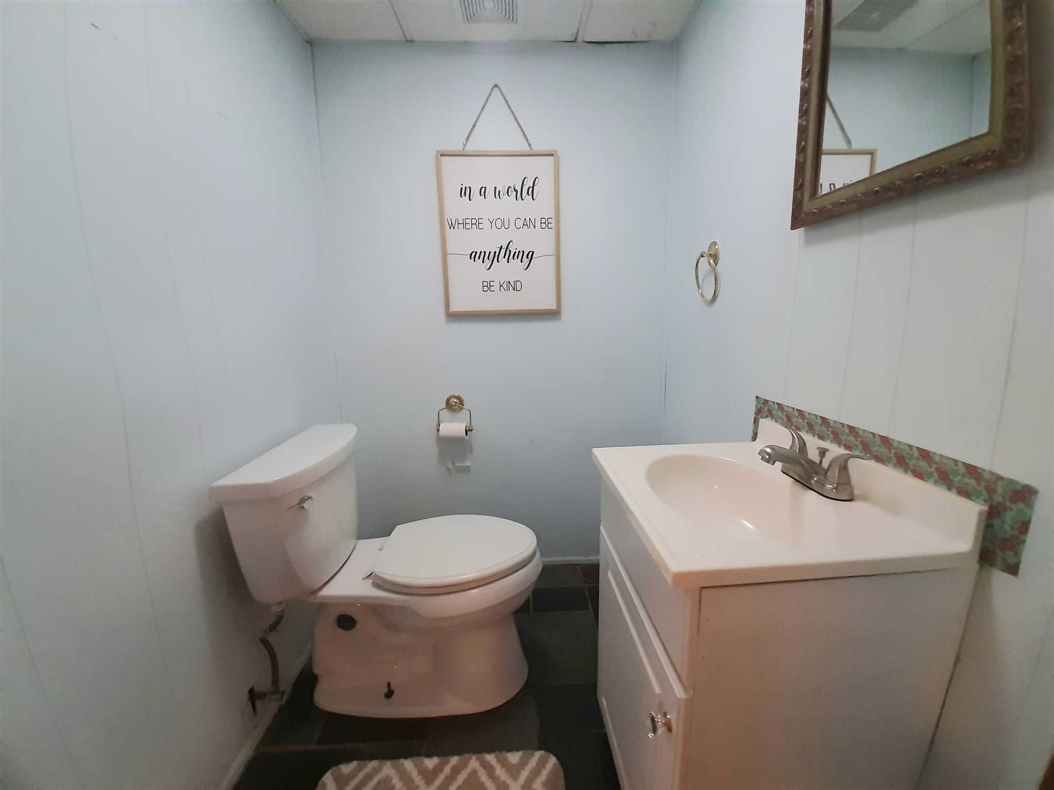 97 Sutton Park Road Poughkeepsie, NY 12603 - Photo 16 of 20 a bathroom with a toilet sink and mirror