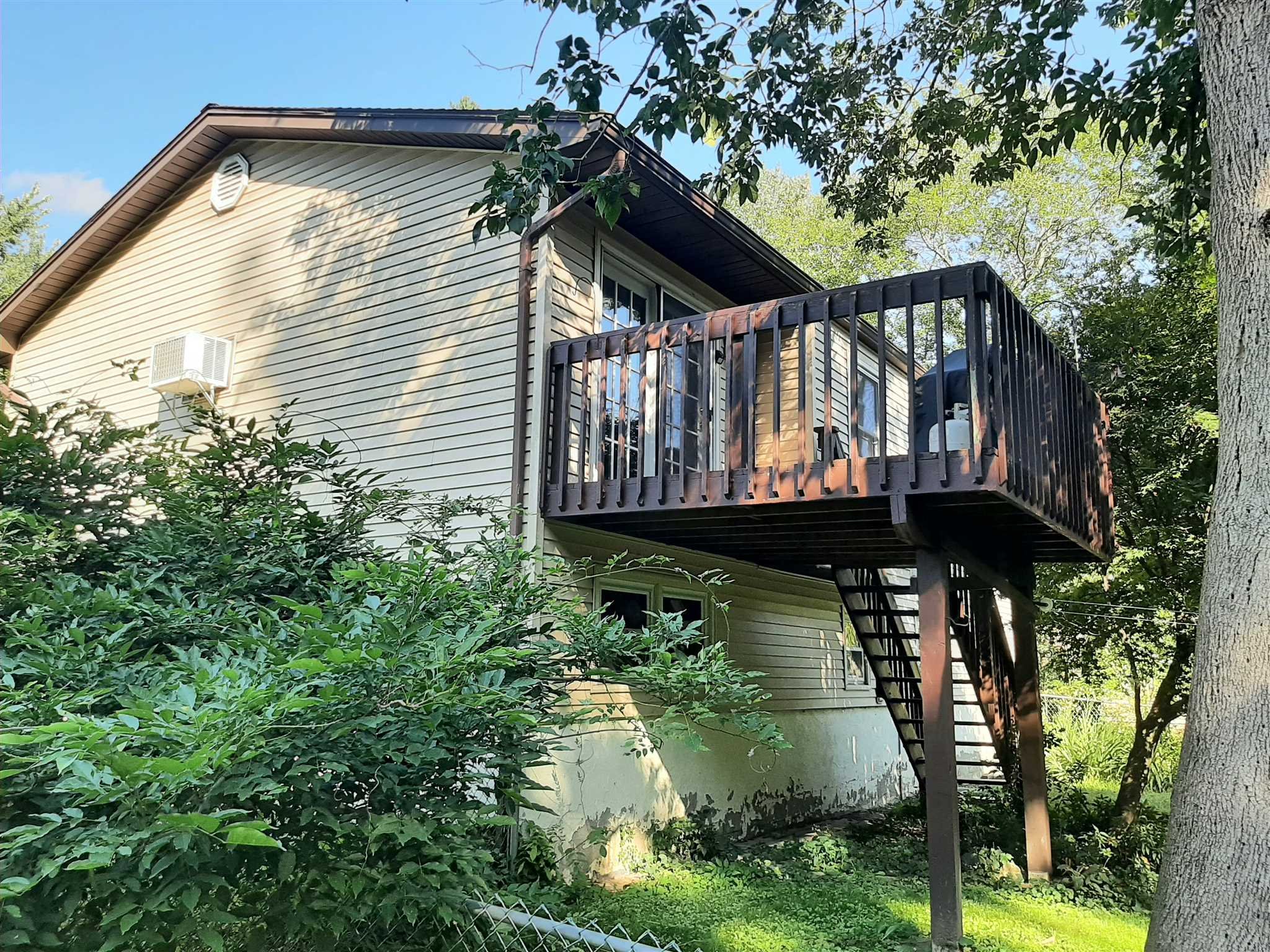 97 Sutton Park Road Poughkeepsie, NY 12603 - Photo 19 of 20 a view of a backyard with a large tree