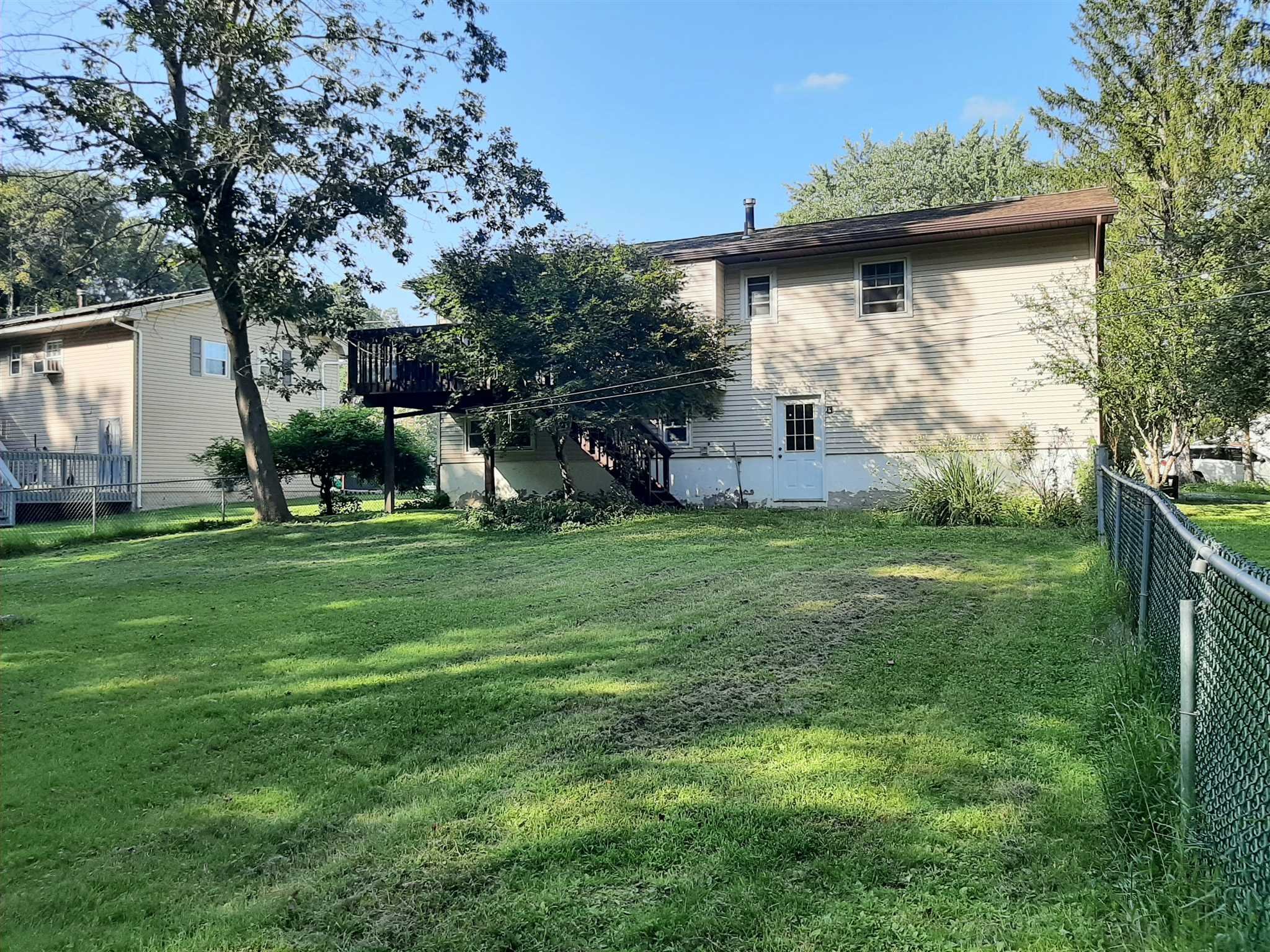 97 Sutton Park Road Poughkeepsie, NY 12603 - Photo 20 of 20 a view of a house with a yard and sitting area