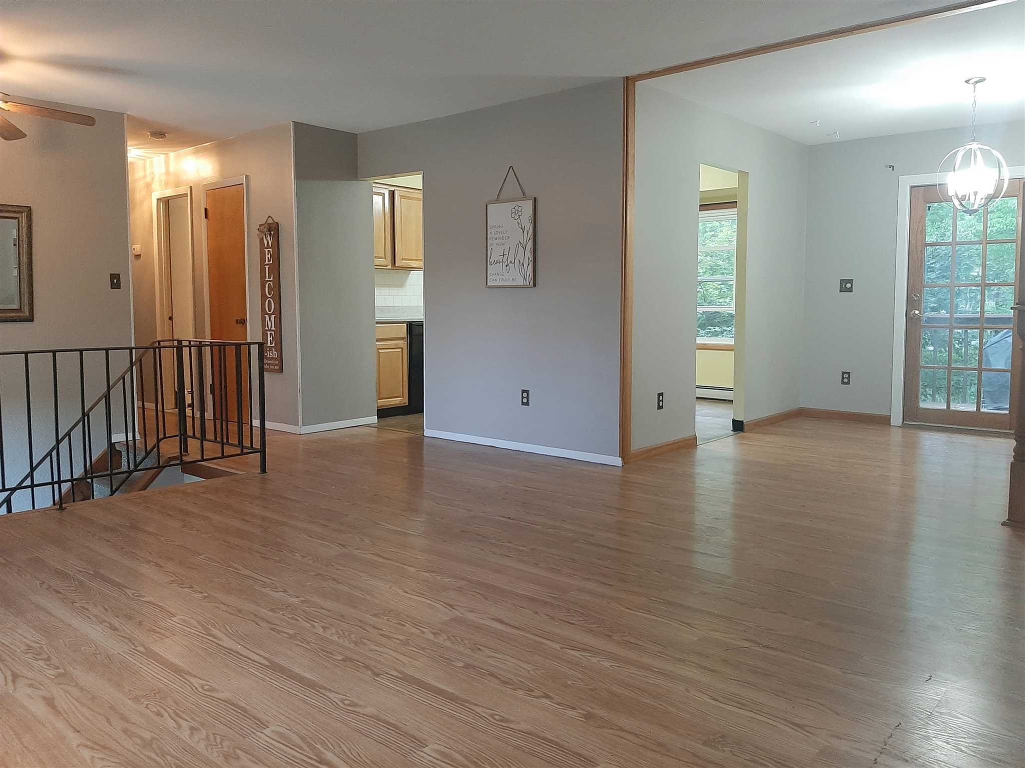 97 Sutton Park Road Poughkeepsie, NY 12603 - Photo 3 of 20 a view of empty room with wooden floor and bathroom