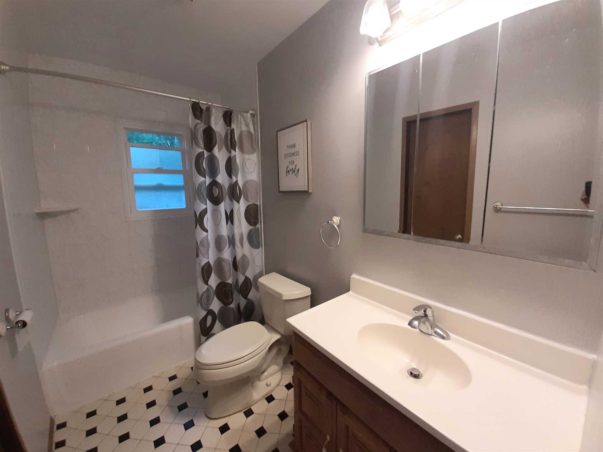97 Sutton Park Road Poughkeepsie, NY 12603 - Photo 9 of 20 a bathroom with a sink a toilet and shower