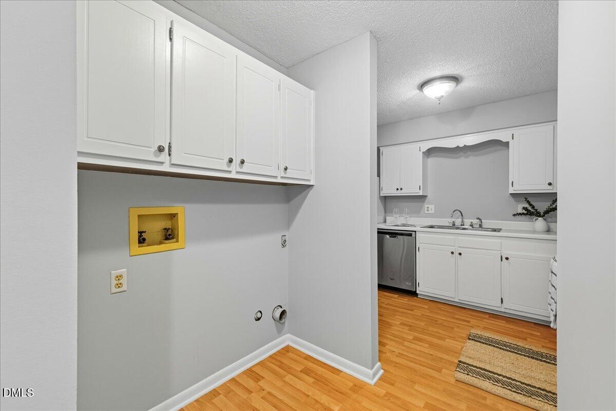627 Pine Ridge Place Raleigh, NC 27609 - Photo 9 of 19 a view of kitchen with wooden floor and electronic appliances