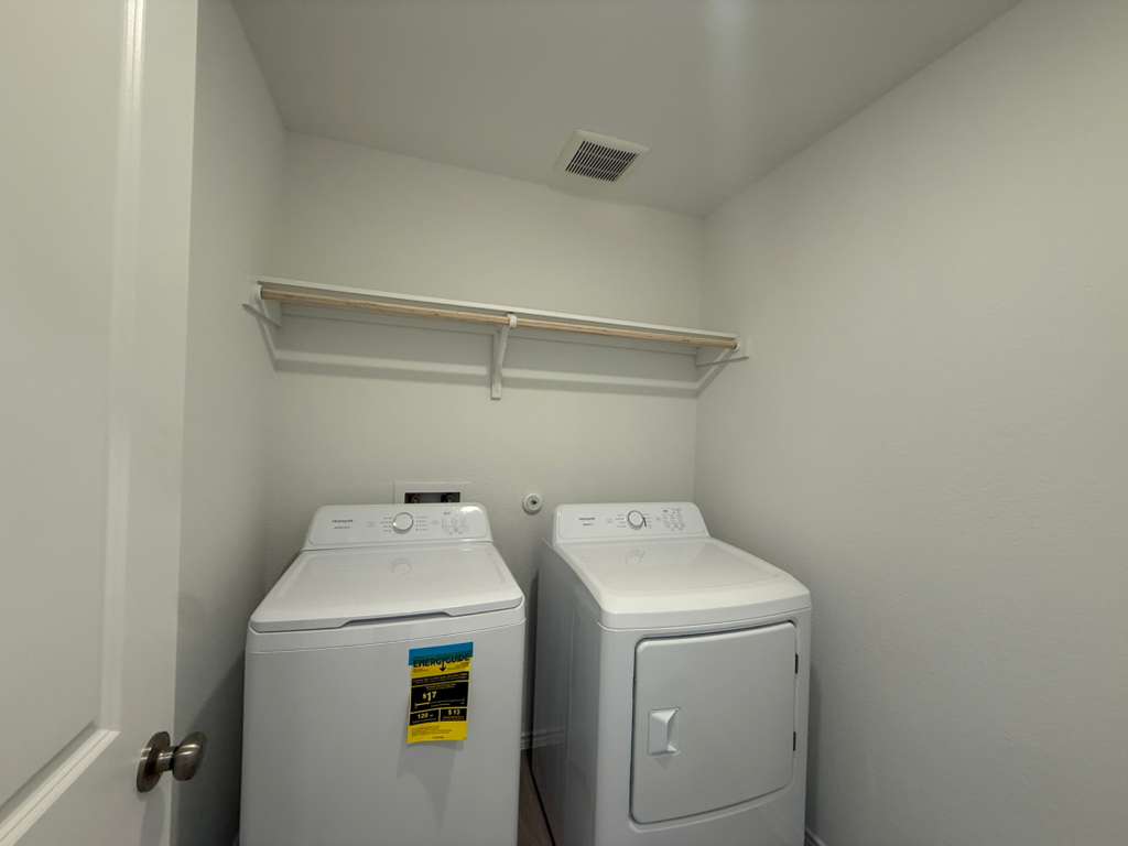591 Sormonne Loop Kyle, TX 78640 - Photo 14 of 40 a utility room with dryer and washer