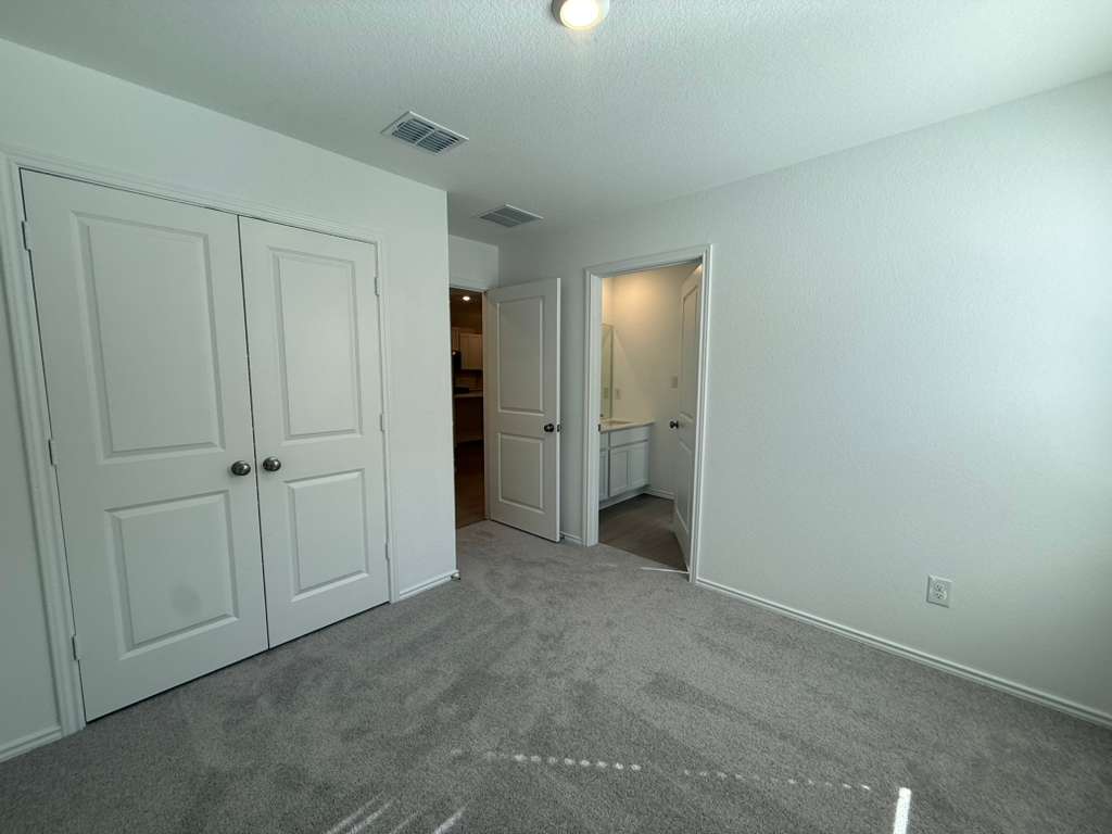 591 Sormonne Loop Kyle, TX 78640 - Photo 15 of 40 an empty room with closet area