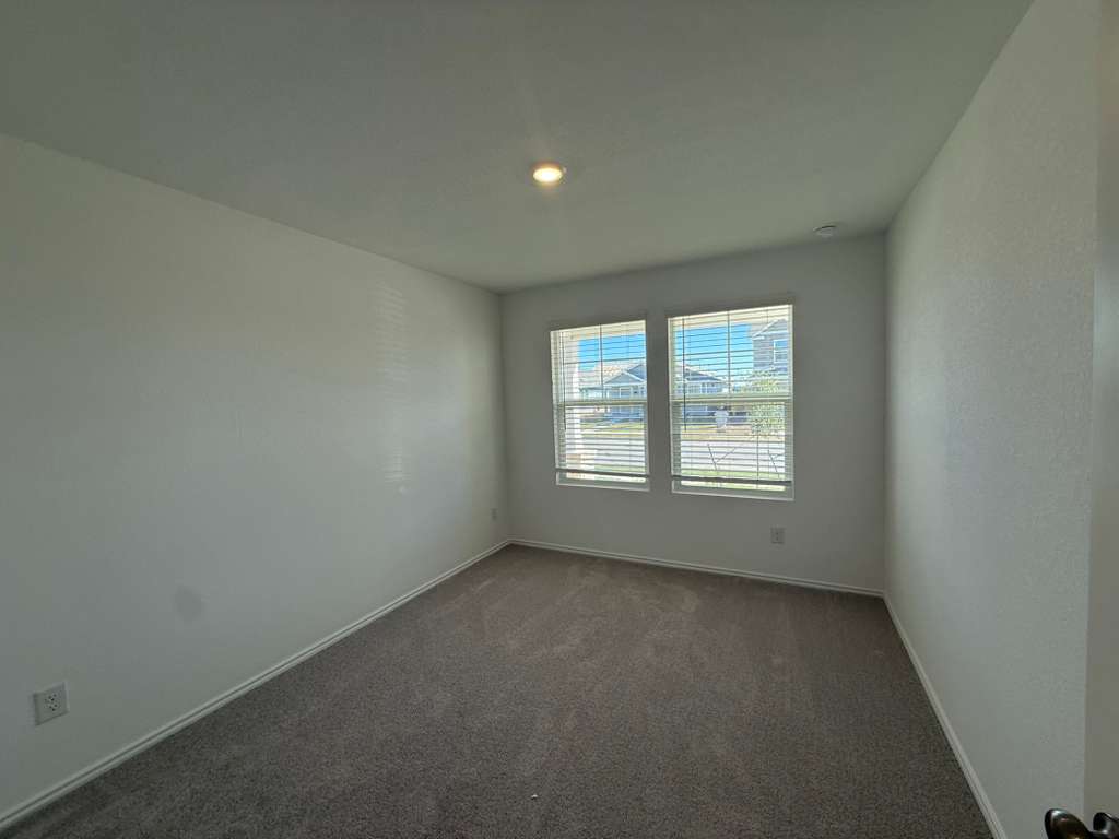 591 Sormonne Loop Kyle, TX 78640 - Photo 18 of 40 an empty room with a window