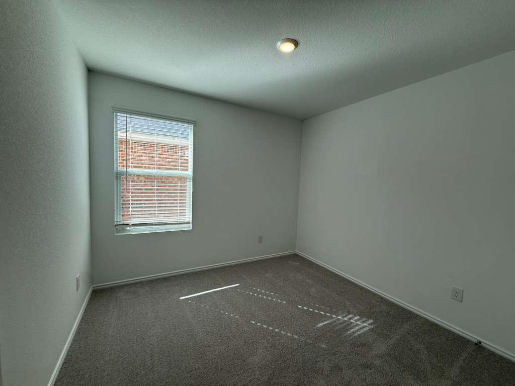 591 Sormonne Loop Kyle, TX 78640 - Photo 22 of 40 an empty room with a window
