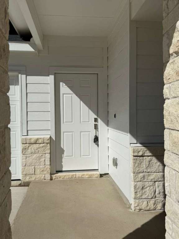 591 Sormonne Loop Kyle, TX 78640 - Photo 3 of 40 a view of front door and bedroom