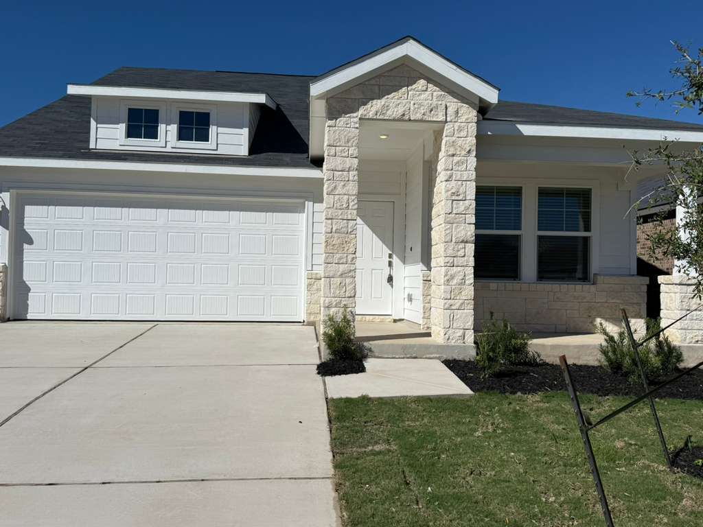 591 Sormonne Loop Kyle, TX 78640 - Photo 5 of 40 a front view of a house with garden