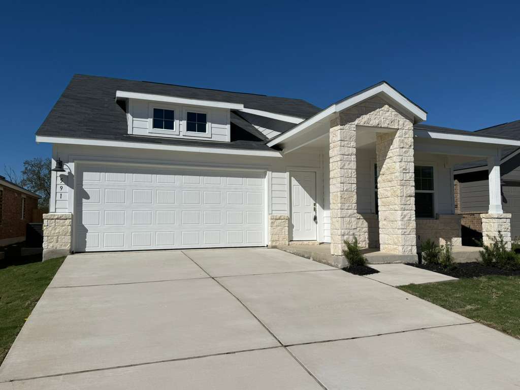 591 Sormonne Loop Kyle, TX 78640 - Photo 6 of 40 a front view of a house with a yard