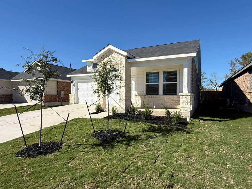 591 Sormonne Loop Kyle, TX 78640 - Photo 7 of 40 a view of a house with backyard and garden