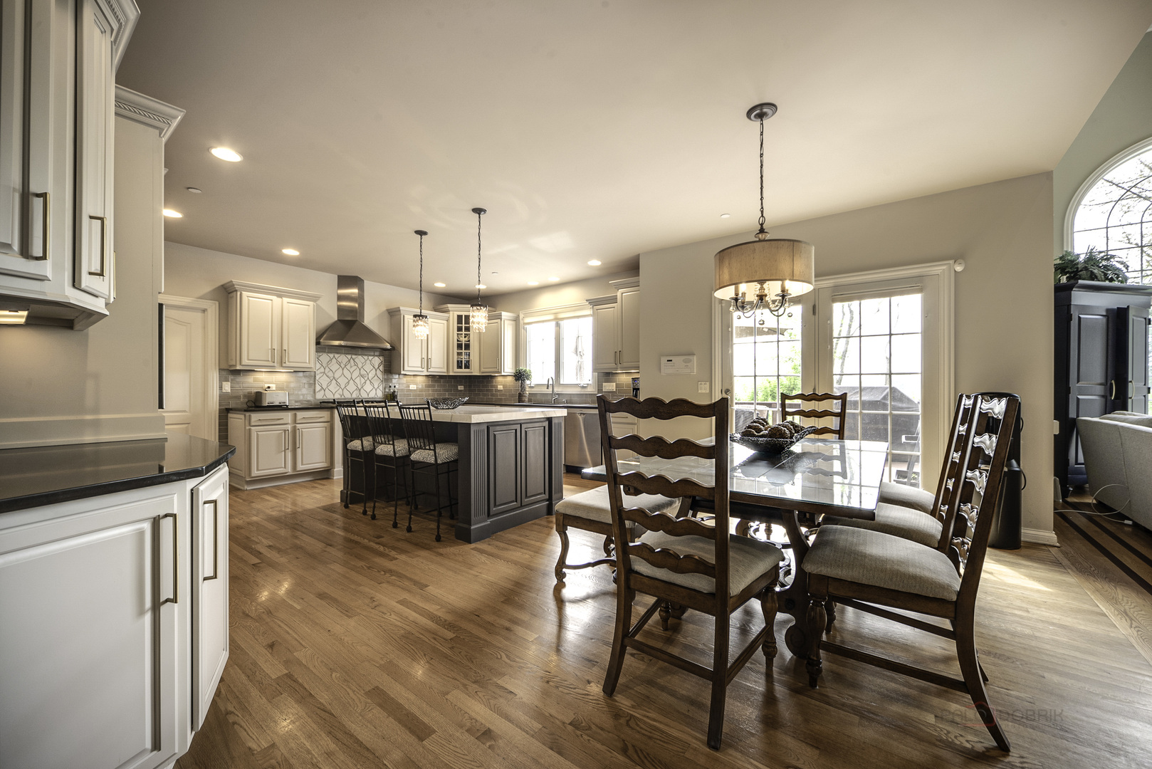 4907 Clover Court Long Grove, IL 60047 - Photo 23 of 67 a view of a dining room and livingroom with furniture wooden floor a chandelier