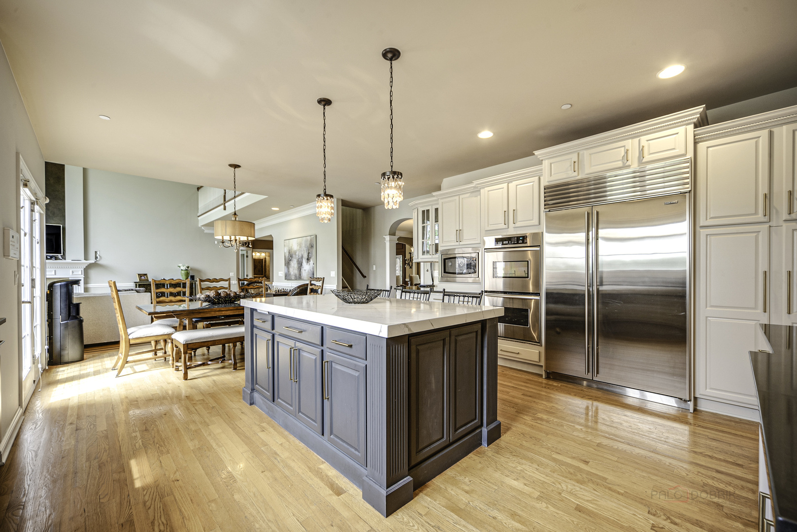 4907 Clover Court Long Grove, IL 60047 - Photo 26 of 67 a kitchen with kitchen island a counter top space a sink stainless steel appliances and cabinets