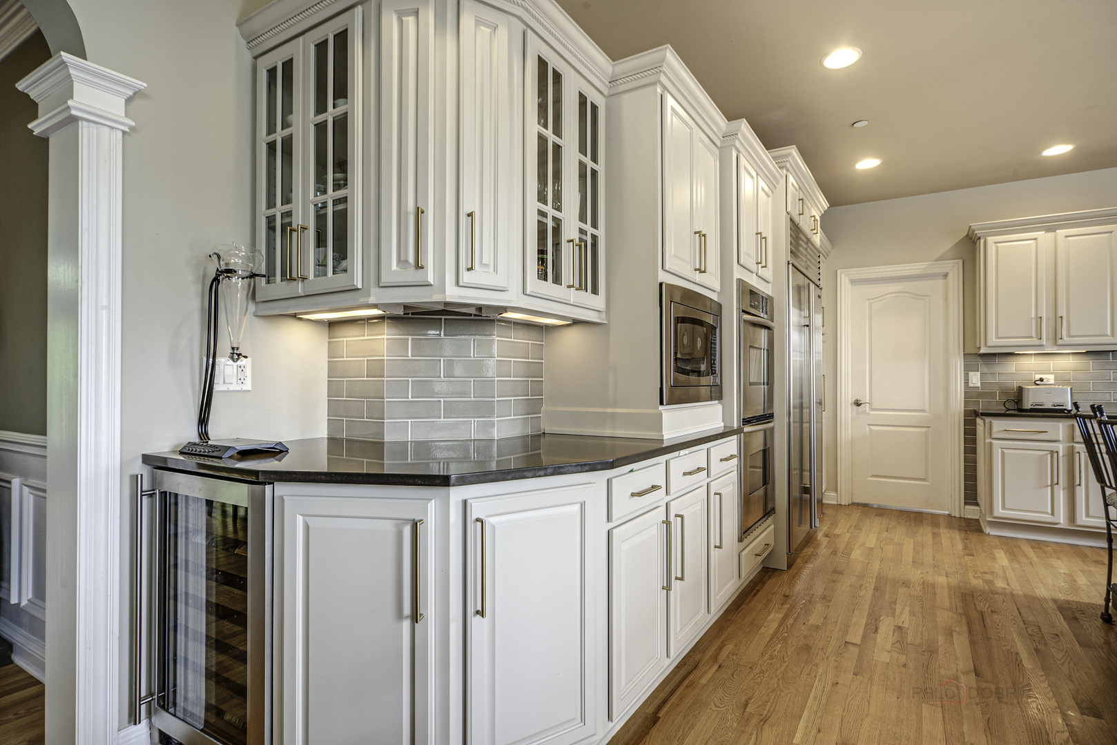 4907 Clover Court Long Grove, IL 60047 - Photo 28 of 67 a kitchen with stainless steel appliances granite countertop a refrigerator a stove and a wooden floors