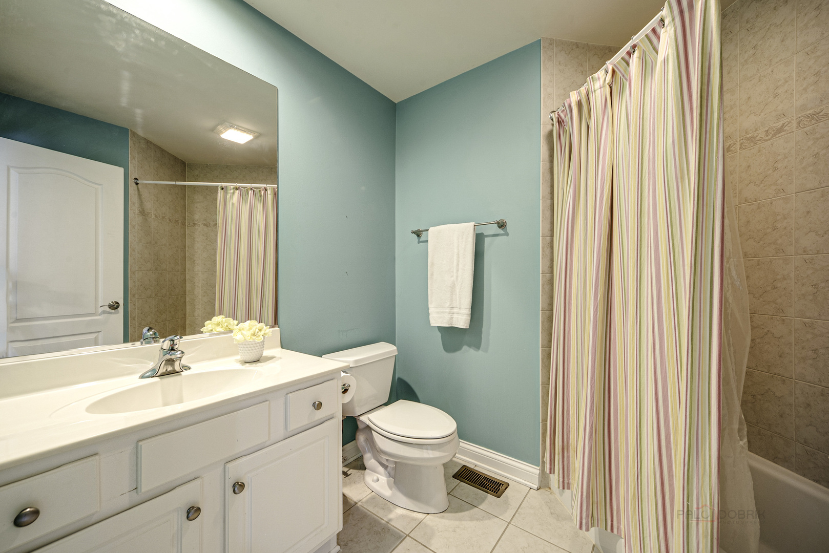 4907 Clover Court Long Grove, IL 60047 - Photo 36 of 67 a bathroom with a sink a toilet and shower curtain