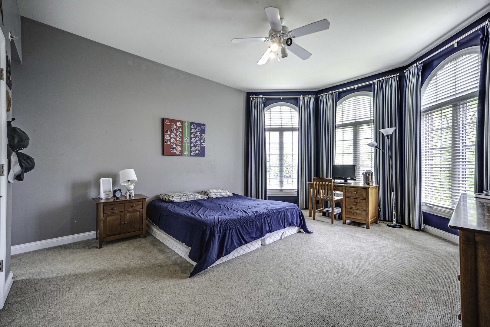4907 Clover Court Long Grove, IL 60047 - Photo 37 of 67 a spacious bedroom with a bed and a chandelier