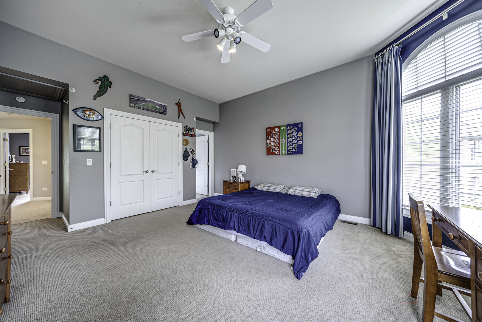4907 Clover Court Long Grove, IL 60047 - Photo 38 of 67 a bedroom with a bed and a chandelier