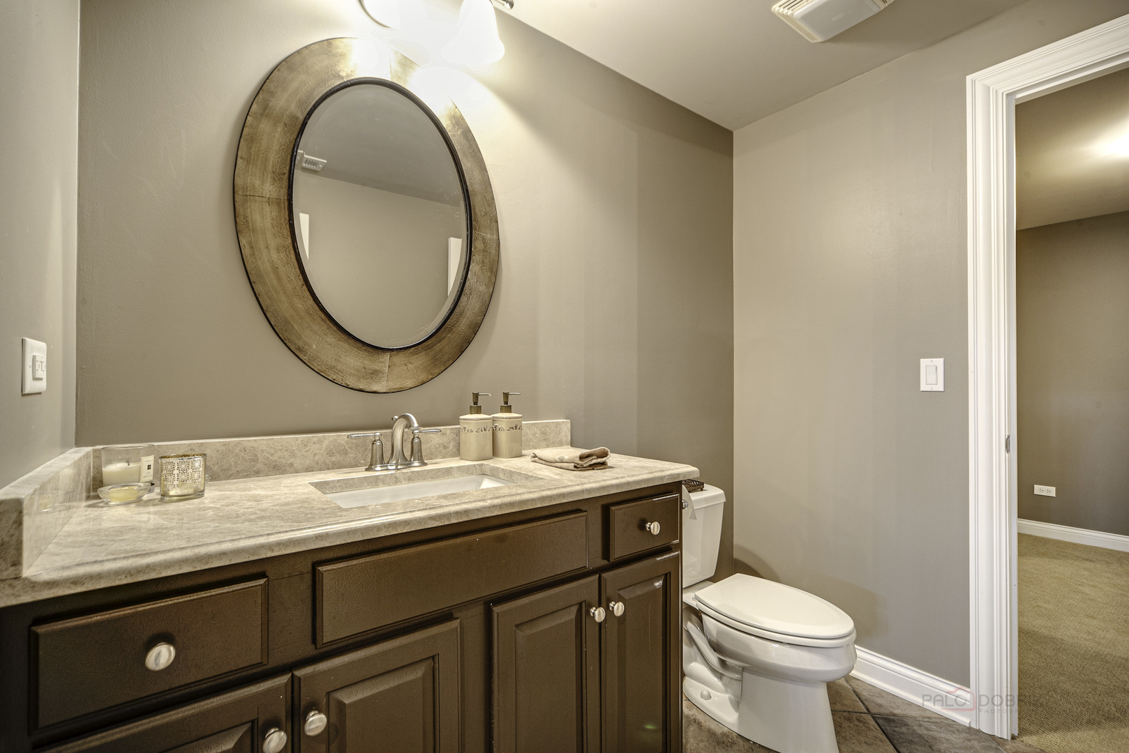 4907 Clover Court Long Grove, IL 60047 - Photo 50 of 67 a bathroom with a granite countertop toilet sink and mirror