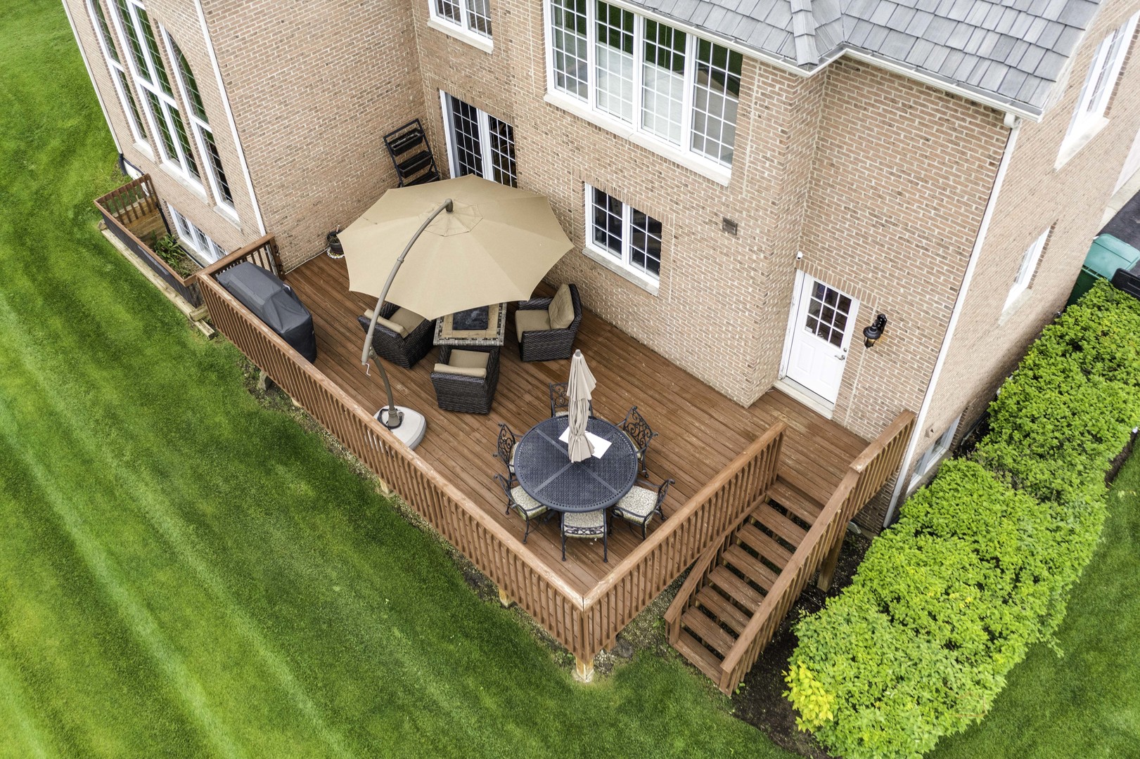 4907 Clover Court Long Grove, IL 60047 - Photo 54 of 67 a backyard of a house with table and chairs