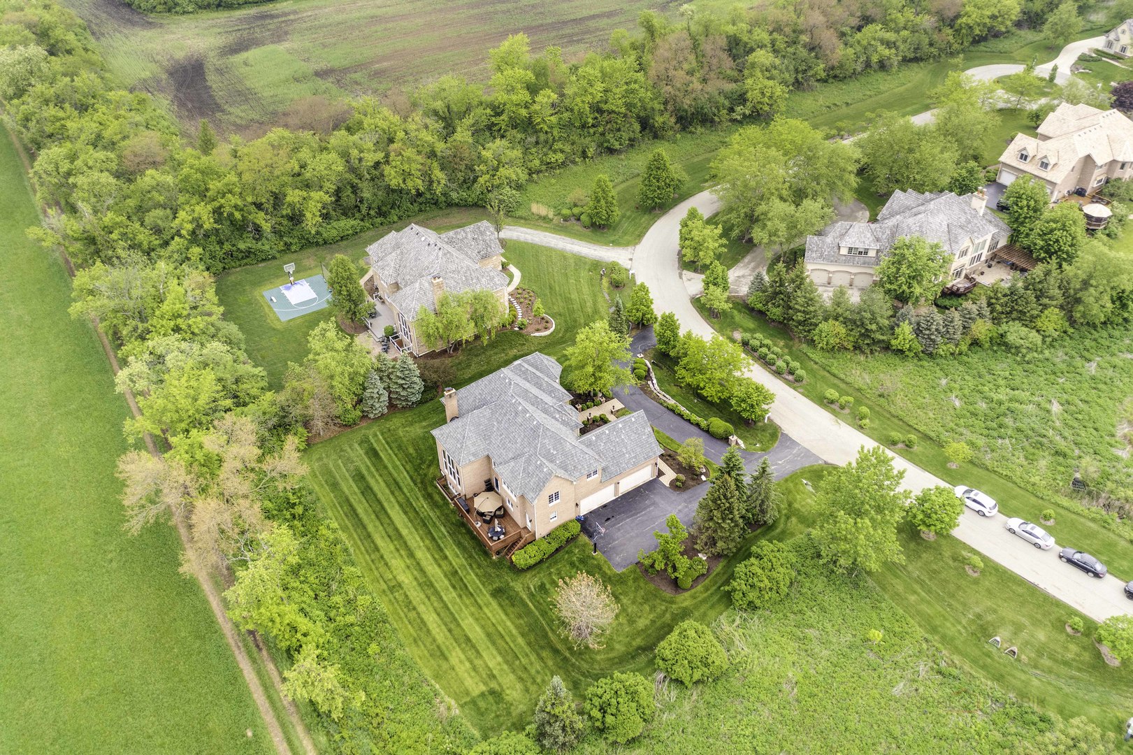4907 Clover Court Long Grove, IL 60047 - Photo 60 of 67 a view of a swimming pool with a yard