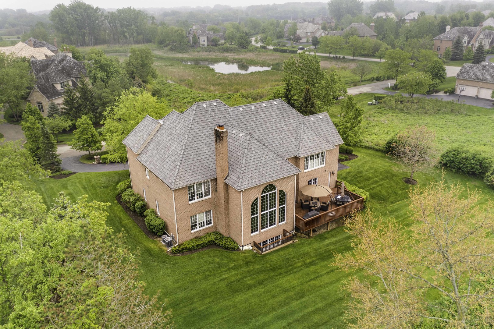 4907 Clover Court Long Grove, IL 60047 - Photo 63 of 67 an aerial view of a house with a yard and lake view