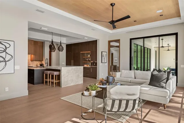 a bathroom with a granite countertop toilet sink and mirror