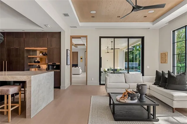 a bathroom with a bathtub shower sink vanity mirror and toilet