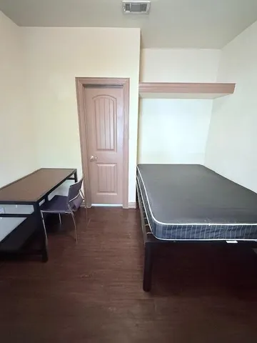 a wooden bench sitting in a room